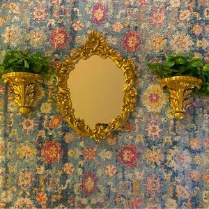 This is a stunning gorgeous Italian ornate gold mirror with wall scones.